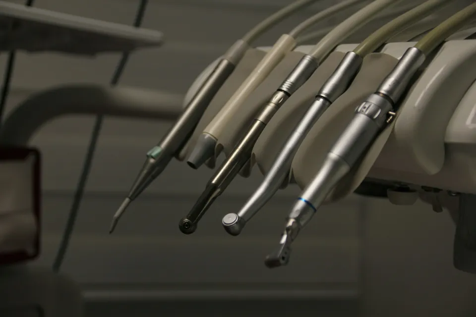 Dental handpieces hanging in the operatory